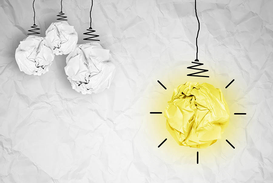 light bulb crumpled paper as creative concept